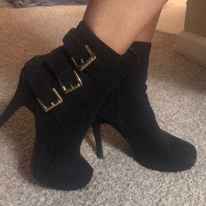 High heel boots with buckles